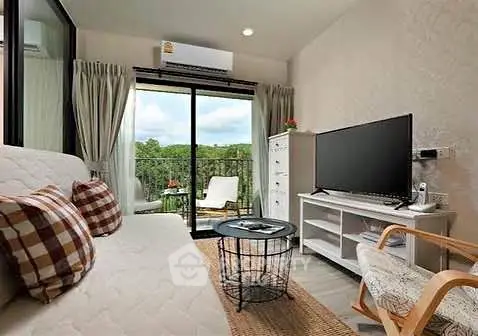 Charming living room with balcony view, cozy seating, and modern decor.