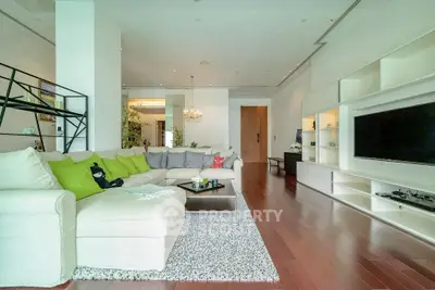 Spacious modern living room with sleek design and vibrant accents