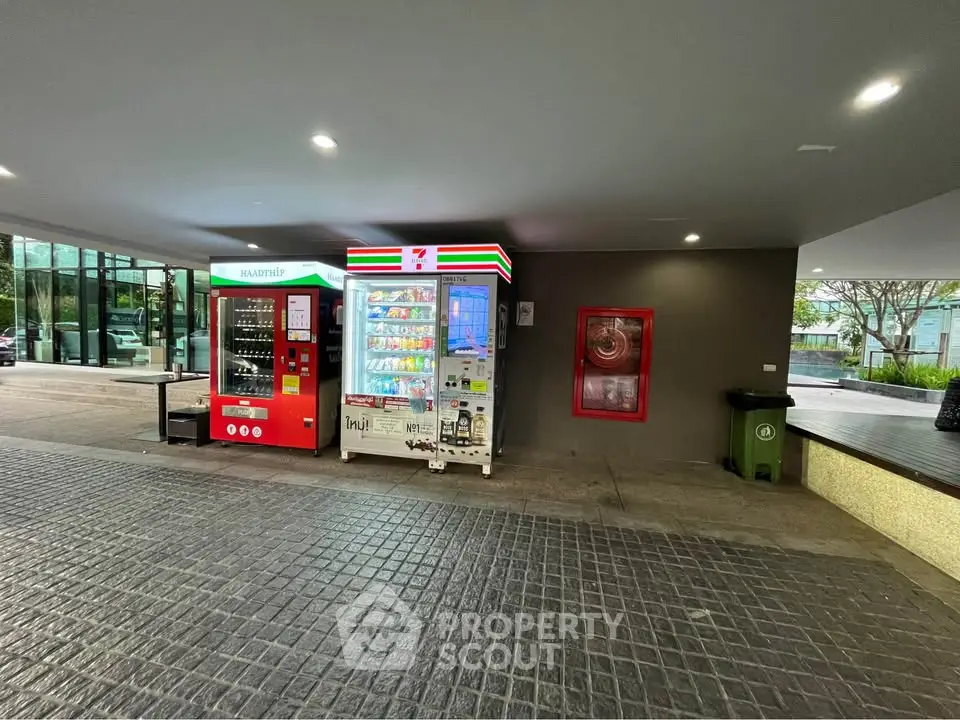Modern building entrance with vending machines and sleek design