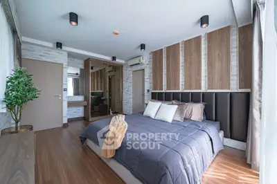 Luxurious modern bedroom with stylish decor and ample natural light