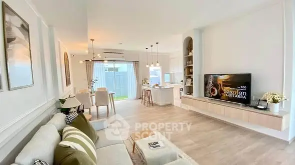 Spacious modern living room with open kitchen and stylish decor