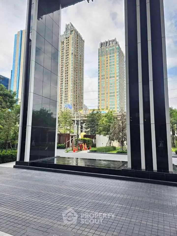 Modern building entrance with sleek design and cityscape view
