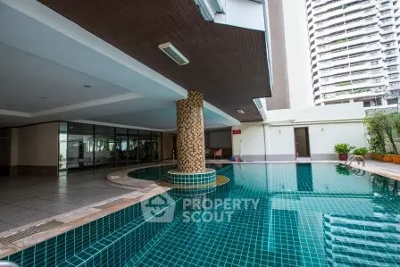 Luxurious condominium with stunning pool area and modern architecture.