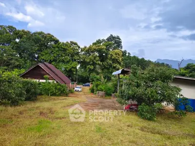Charming rural property with lush greenery and cozy house, perfect for nature lovers seeking tranquility.