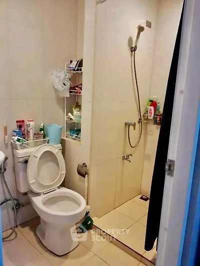 Compact bathroom with shower and toilet in modern apartment