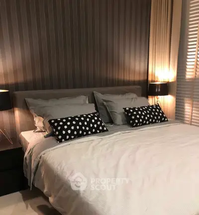 Cozy modern bedroom with stylish decor and ambient lighting, perfect for relaxation and comfort.
