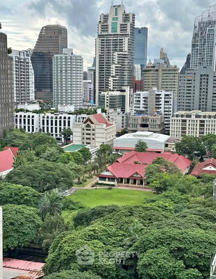 Stunning cityscape view with lush greenery and modern skyscrapers, perfect for urban living enthusiasts.