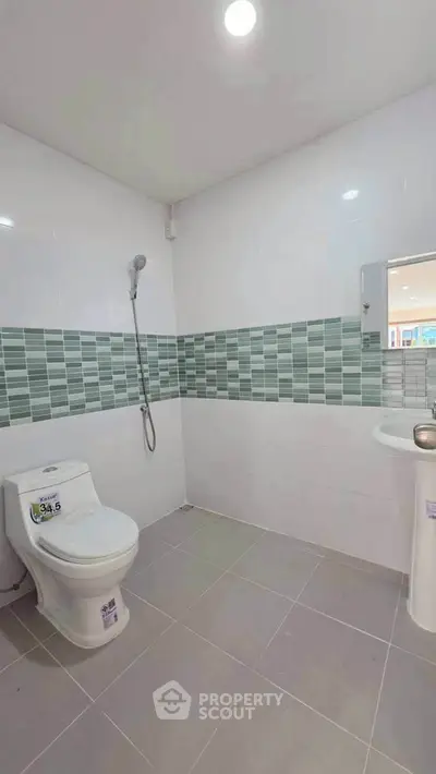 Modern bathroom with sleek tiles and contemporary fixtures