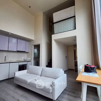Modern loft apartment with high ceilings and stylish kitchen
