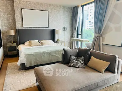 Luxurious bedroom with elegant decor and large windows offering a city view.
