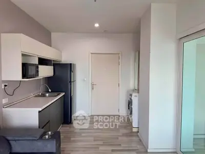 Modern kitchen with sleek appliances and open layout in a stylish apartment