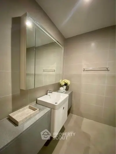 Modern bathroom with sleek design and elegant fixtures in a contemporary home.