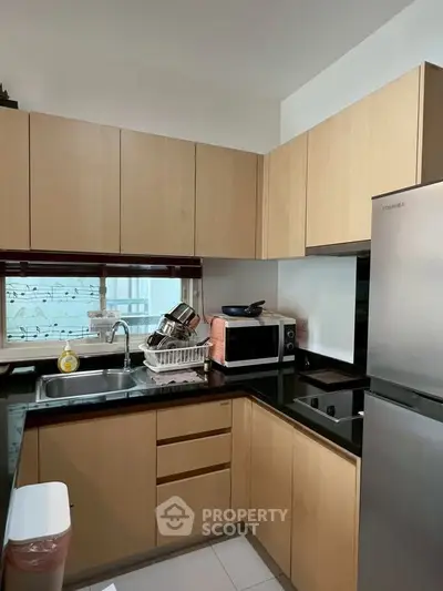 Modern kitchen with sleek cabinetry and stainless steel appliances