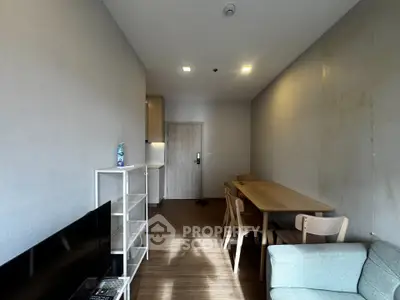 Modern living room with sleek furniture and natural light, perfect for cozy gatherings.