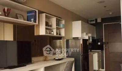 Modern apartment interior with sleek kitchen and cozy dining area, perfect for urban living.