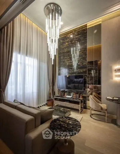 Luxurious living room with elegant chandelier and modern decor