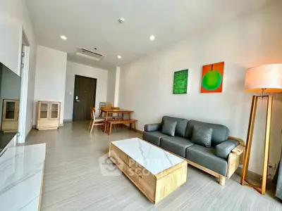 Modern living room with stylish furniture and bright decor in a spacious apartment.