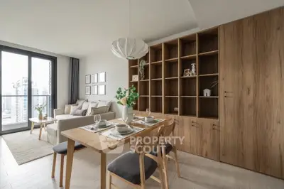 Modern living room with dining area and large windows offering city views