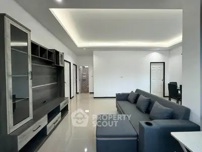 Modern living room with sleek furniture and ambient lighting