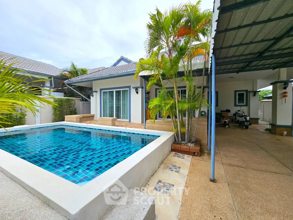 Charming villa with private pool and lush garden in tropical setting.