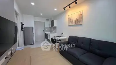 Modern living room with sleek kitchen in open layout apartment