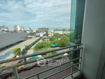 Spacious balcony with panoramic city view, perfect for relaxation and enjoying urban scenery.