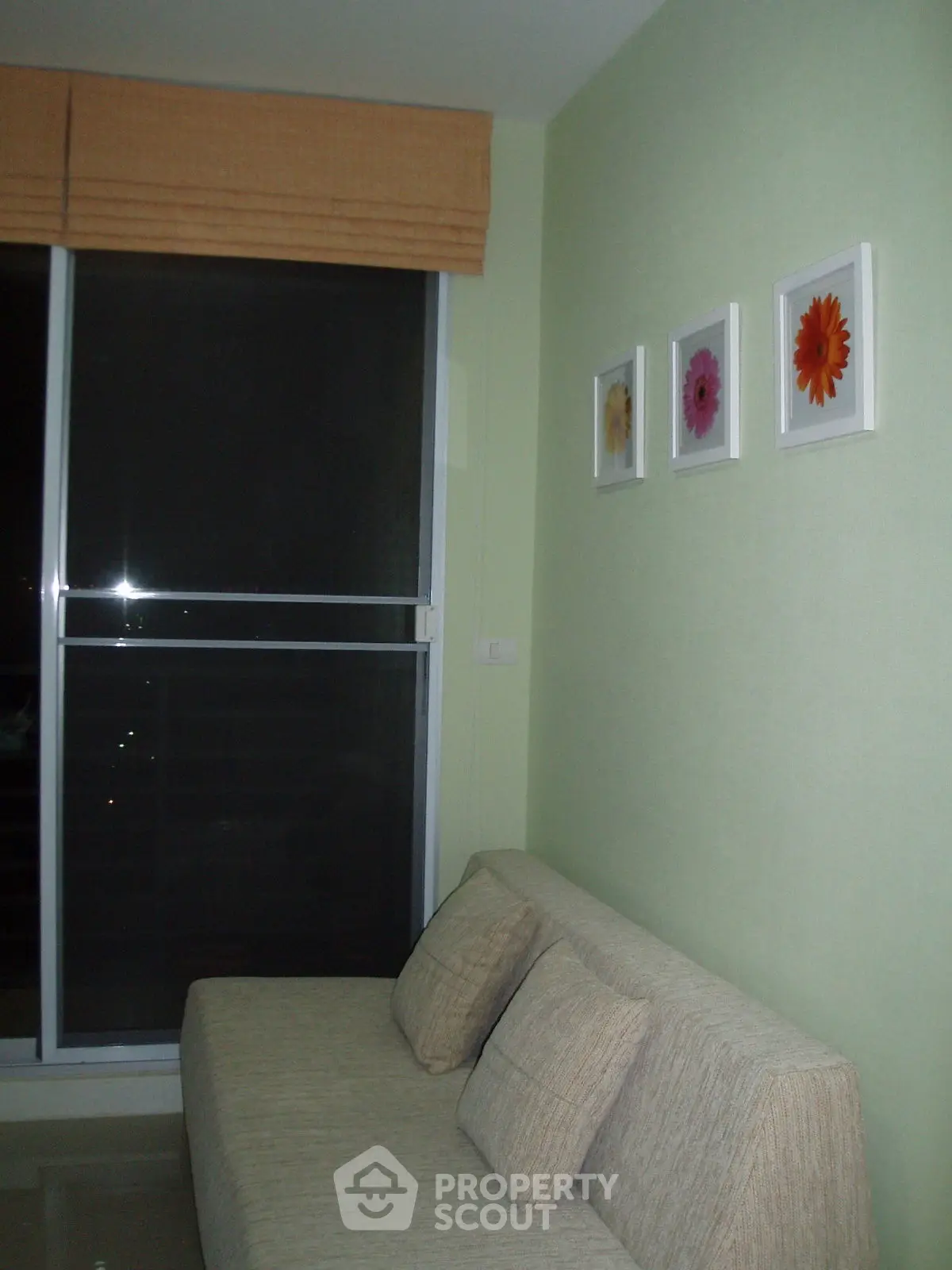 Cozy living room with modern sofa and floral wall art