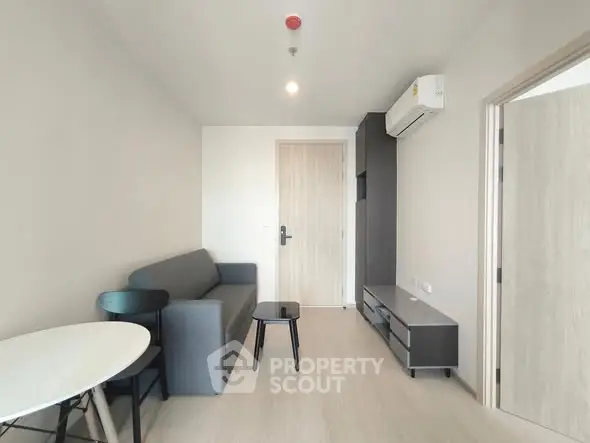 Modern living room with minimalist furniture and air conditioning