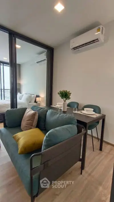 Modern living room with cozy sofa and dining area in stylish apartment