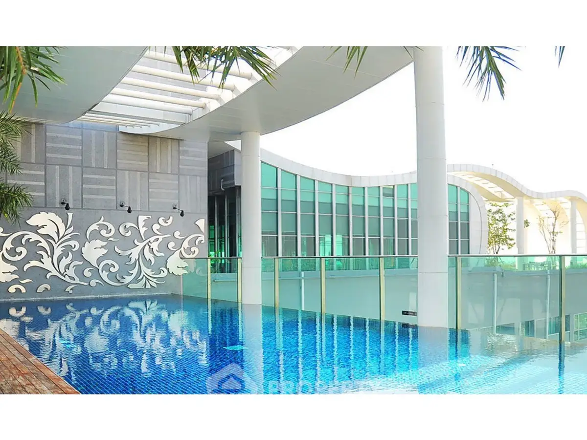 Luxurious rooftop pool with modern architectural design and stunning glass railings.