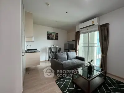 Modern living room with sleek furniture and balcony view