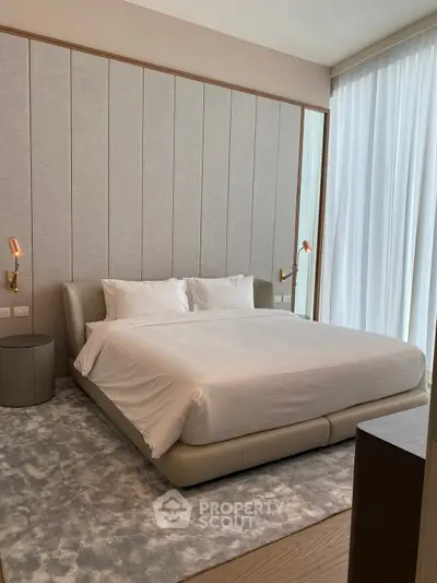 Luxurious modern bedroom with elegant decor and floor-to-ceiling windows