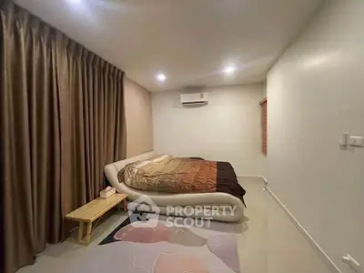 Spacious bedroom with modern design and cozy ambiance