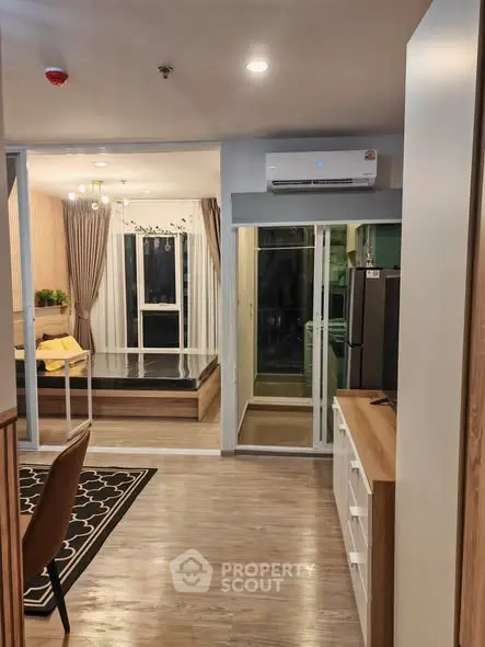 Modern open-plan living space with stylish decor and wooden flooring