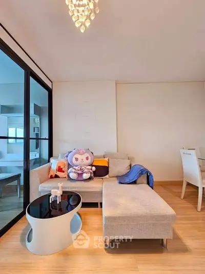 Modern living room with stylish furniture and elegant decor in a cozy apartment setting.