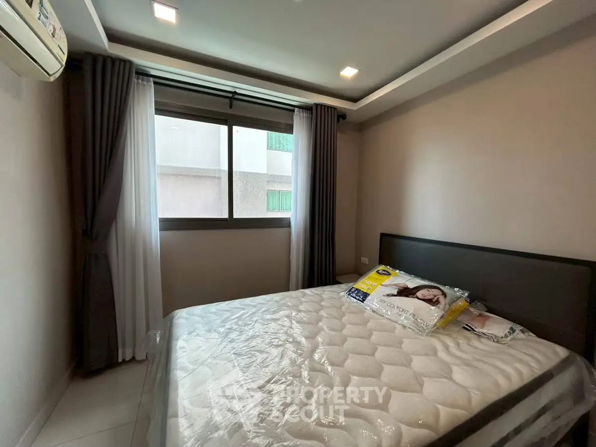 Cozy bedroom with modern decor and natural light