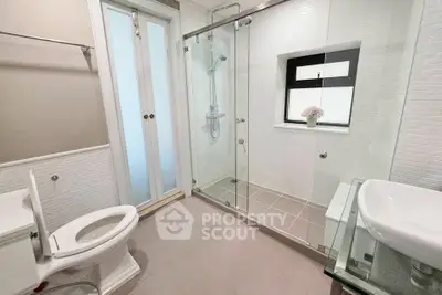 Modern bathroom with glass shower and elegant fixtures