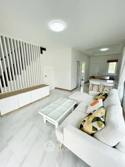 Spacious modern living room with stylish decor and natural light