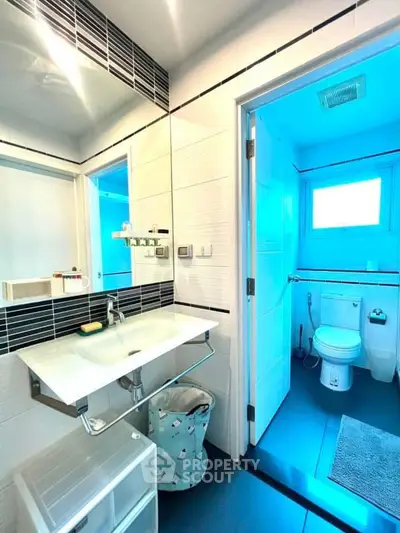 Modern bathroom with sleek fixtures and bright lighting