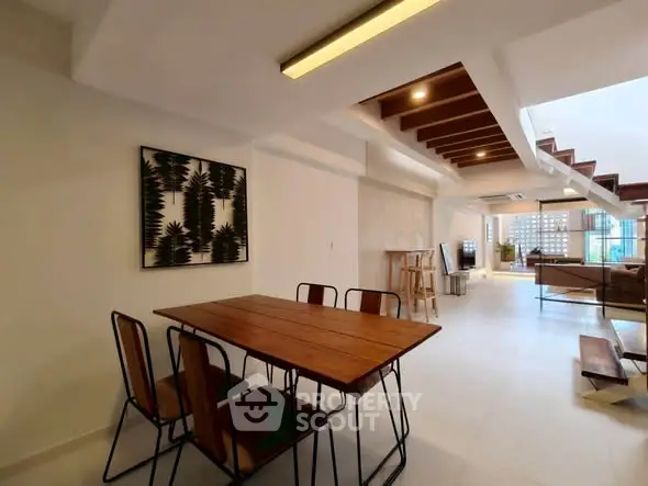 Spacious modern living room with open layout and stylish dining area