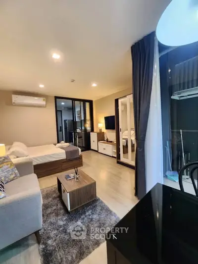 Modern studio apartment with cozy living area and stylish decor