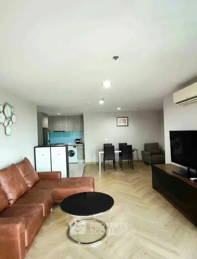 Spacious modern living room with open kitchen and stylish furniture