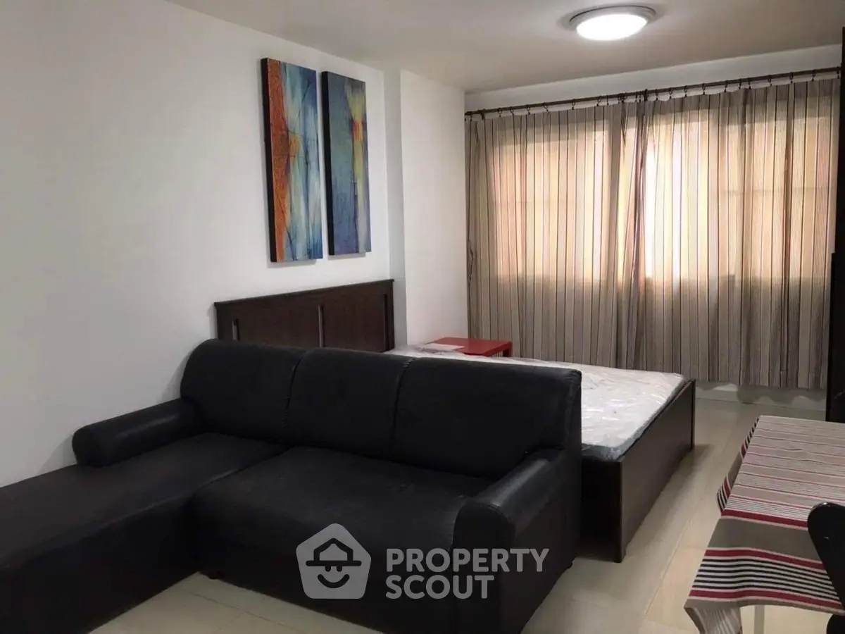Cozy studio apartment with modern decor and ample natural light