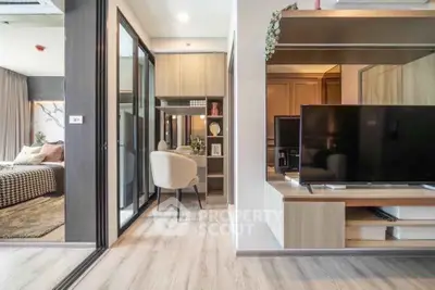 Modern apartment interior with open layout, featuring a cozy bedroom and stylish living area.