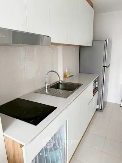 Modern kitchen with sleek appliances and minimalist design