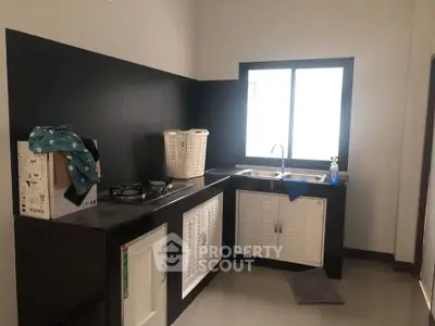 Modern kitchen with sleek black countertops and gas stove