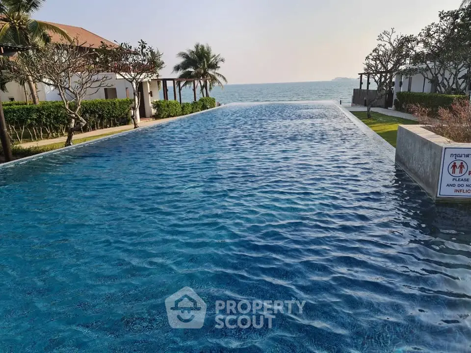 Luxurious infinity pool with ocean view at a tropical resort