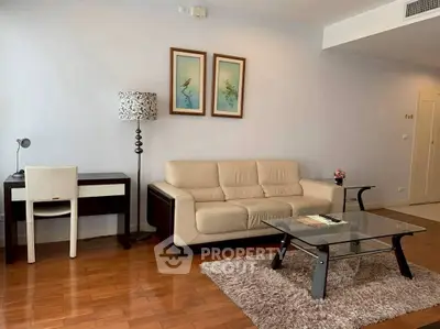 Spacious living room with modern decor and elegant furniture in a stylish apartment.