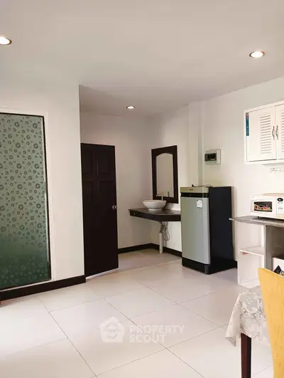 Spacious interior with modern kitchenette and sleek design