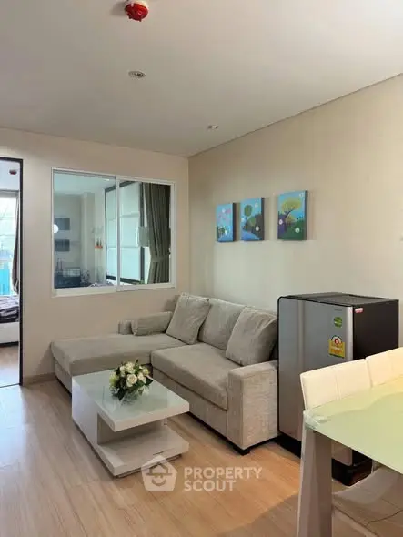 Modern living room with cozy sofa and stylish decor in a contemporary apartment.